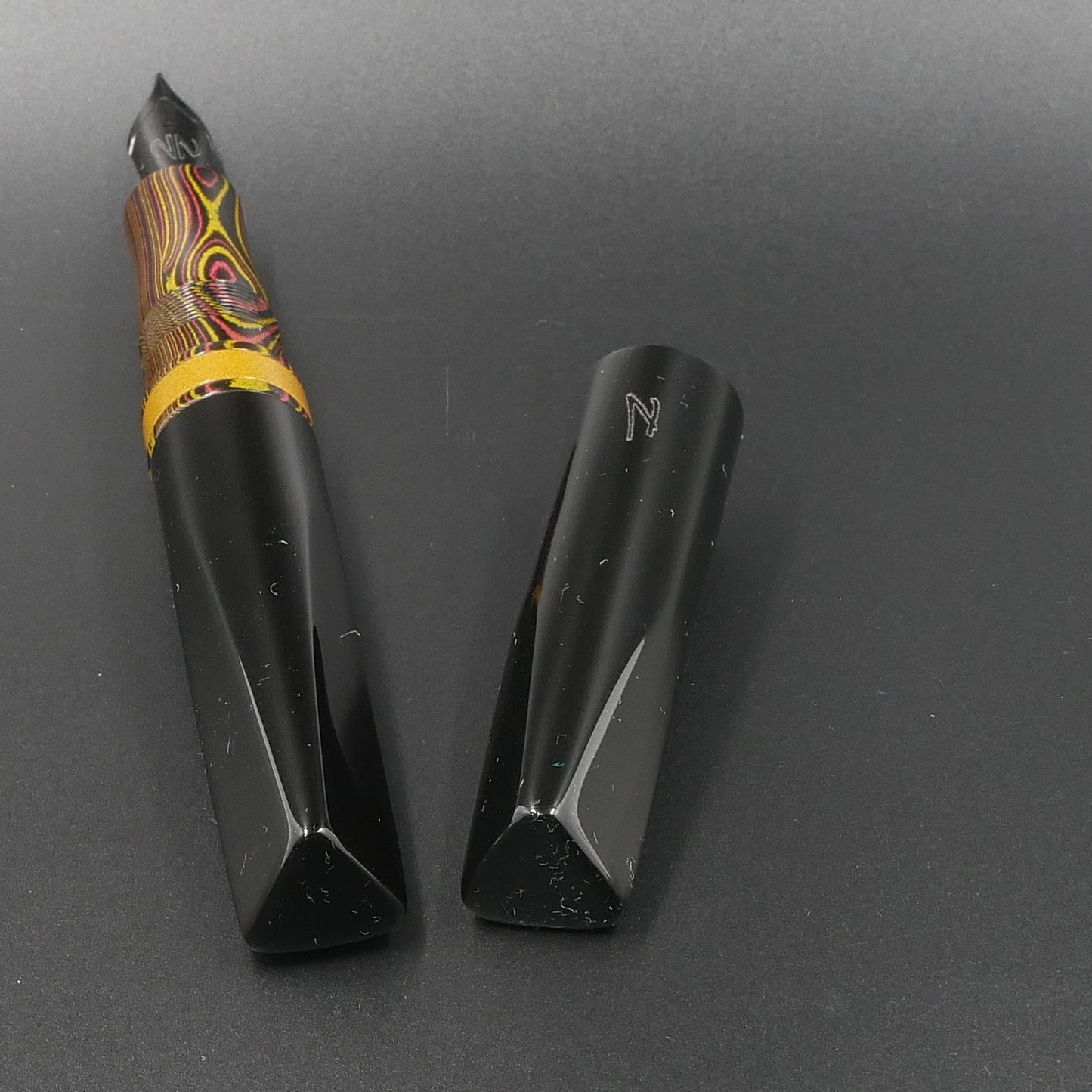 Prospector - Medium - Nikko Autumn lines and Solid black ebonite - Jowo #6 nib