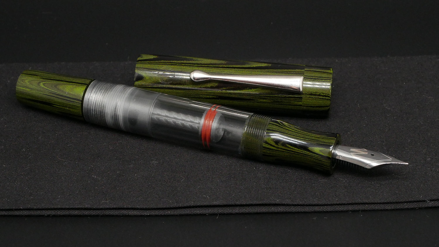 Orville - Large - Nikko green ripple ebonite, clear gray acrylic - clip - piston - #6 nib