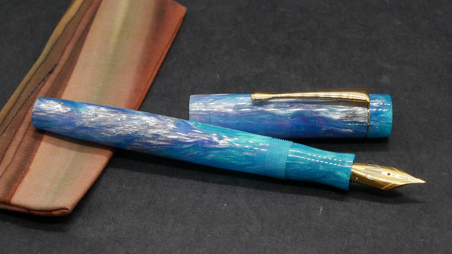 Orville - small - Motor City Pen Co Sky Blue resin  (traces of purple)- clip - #6 nib