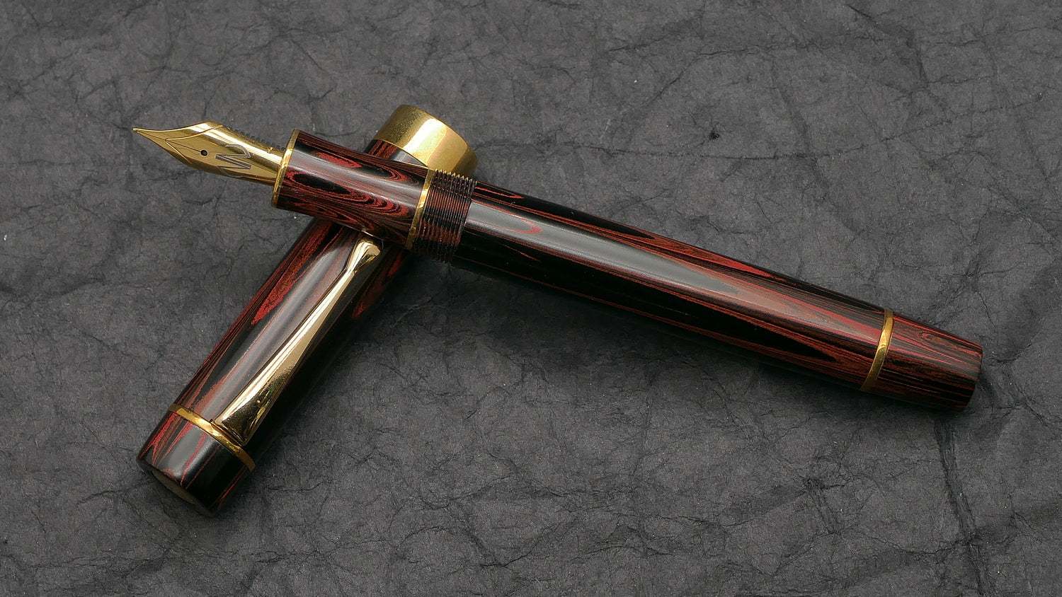 Orville - Medium - SEM Red ripple ebonite - brass trim - clip - #6 nib