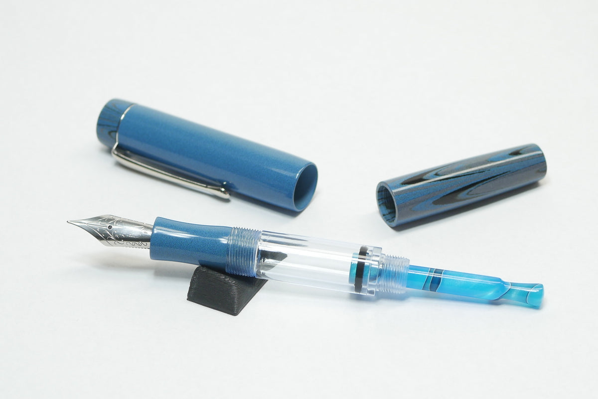 Orville - small - NIKKO Solid and Ripple Light Blue ebonite - Jowo #6 - Syringe fill