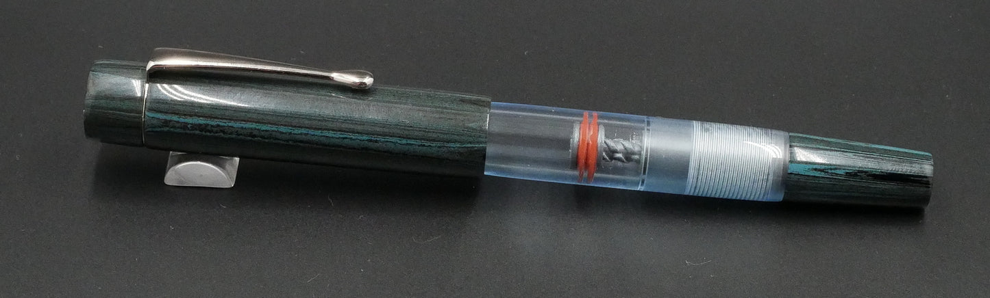 Orville - Small - NYH Teal ebonite, clear blue acrylic - clip - piston - #6 nib