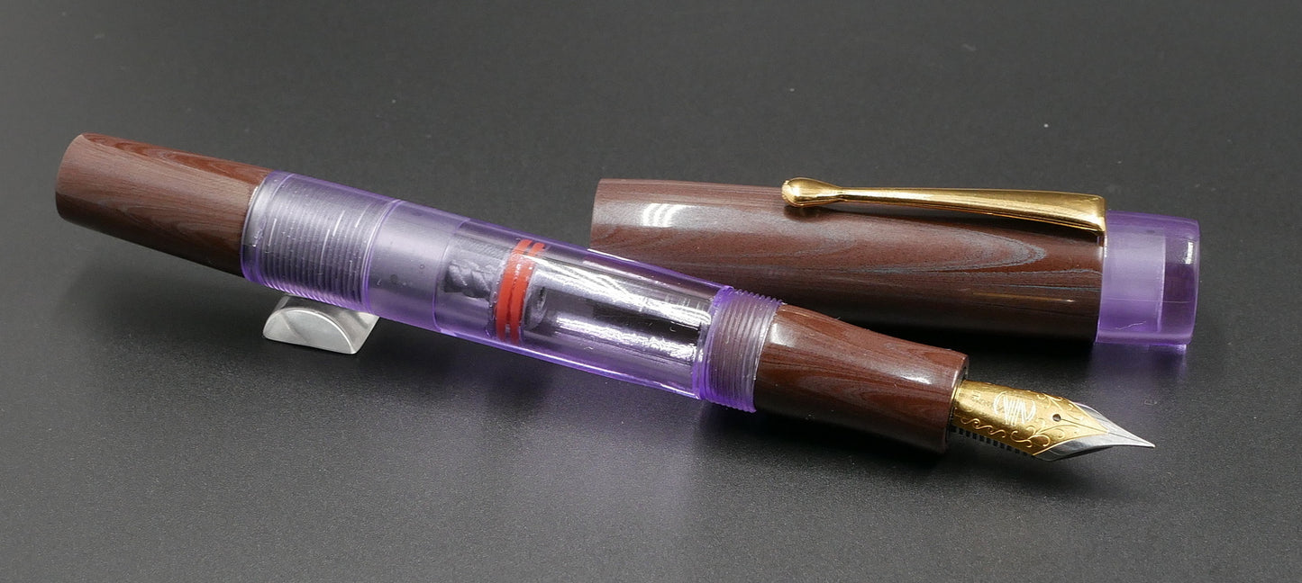 Orville - Medium - Nikko Purple/Pink ebonite and clear purple acrylic - clip - piston - #6 nib