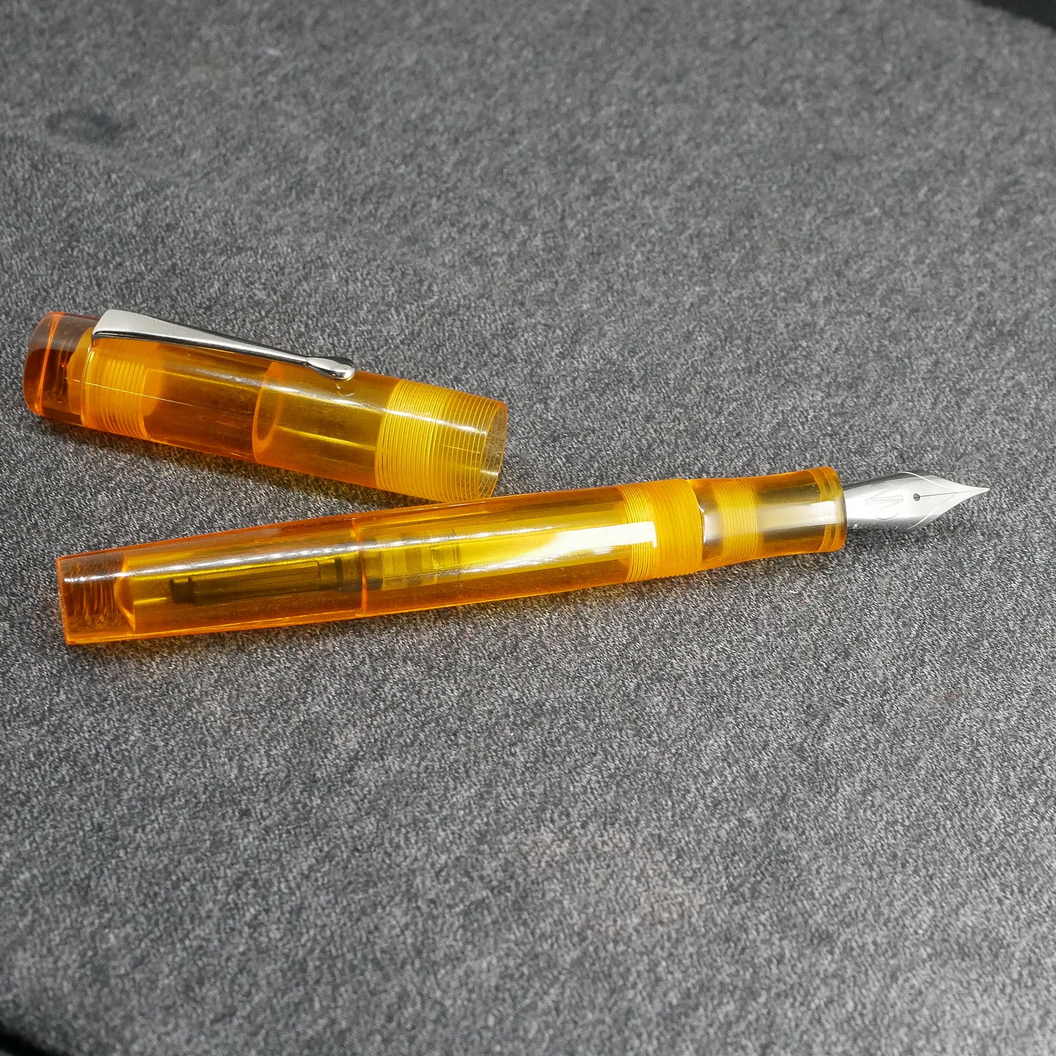 Orville - Medium - Clear orange acrylic - clip - #6 nib