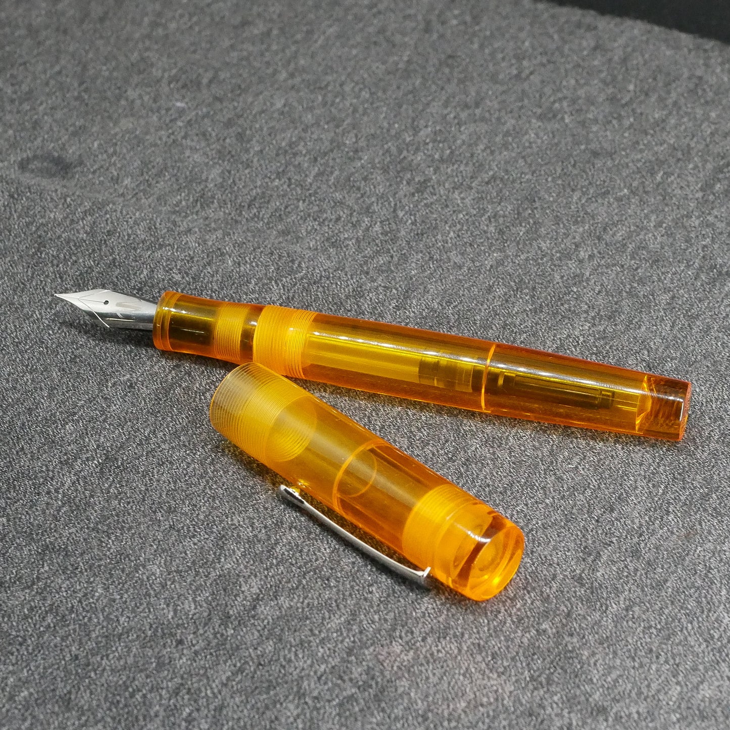 Orville - Medium - Clear orange acrylic - clip - #6 nib