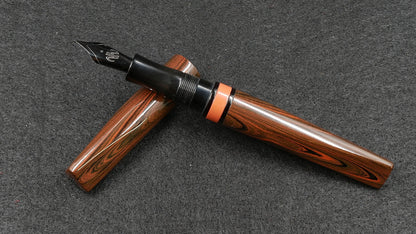 Prospector - Small - Nikko Orange triple ripple and solid black ebonite - Jowo #6 nib