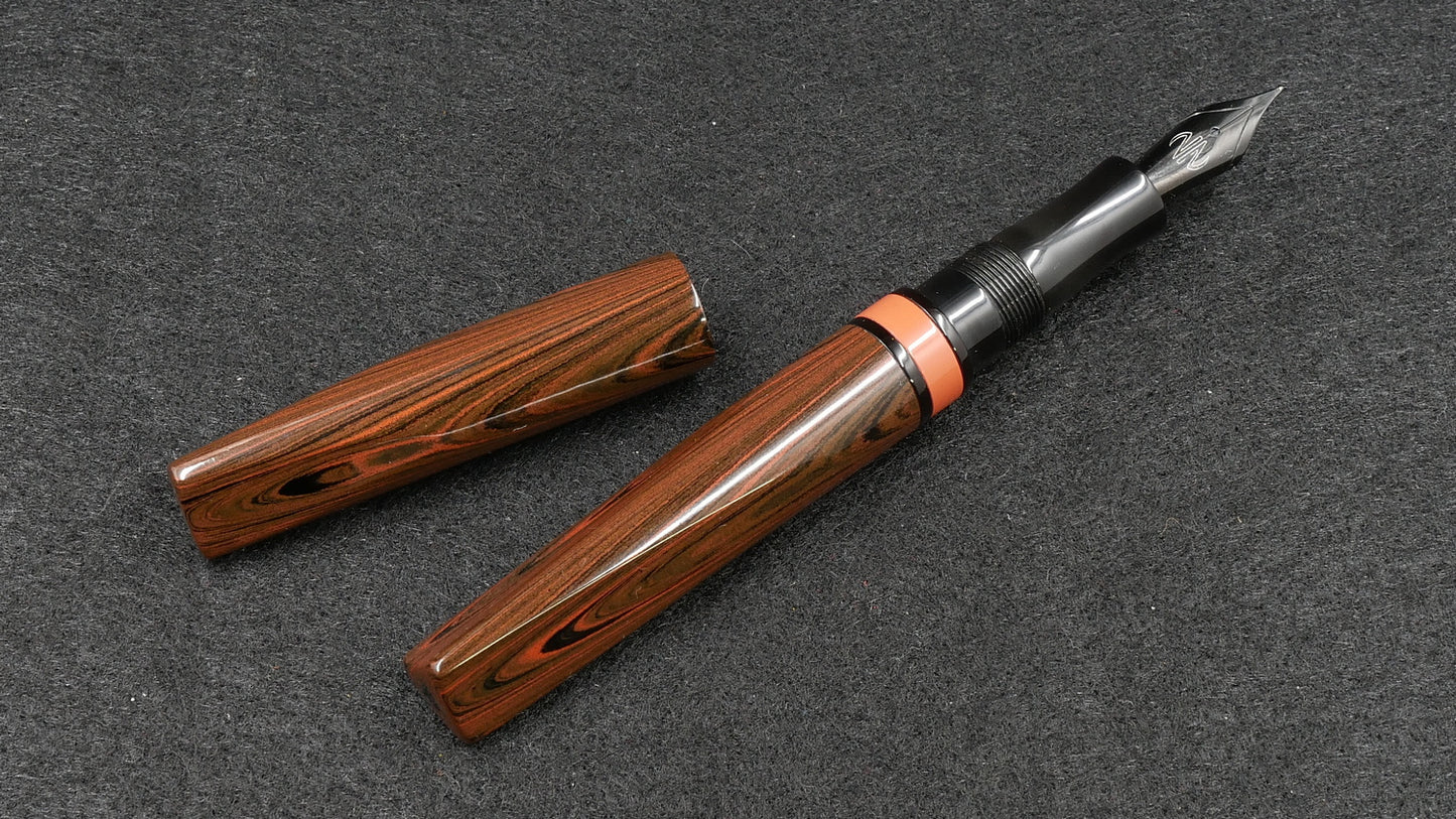 Prospector - Small - Nikko Orange triple ripple and solid black ebonite - Jowo #6 nib