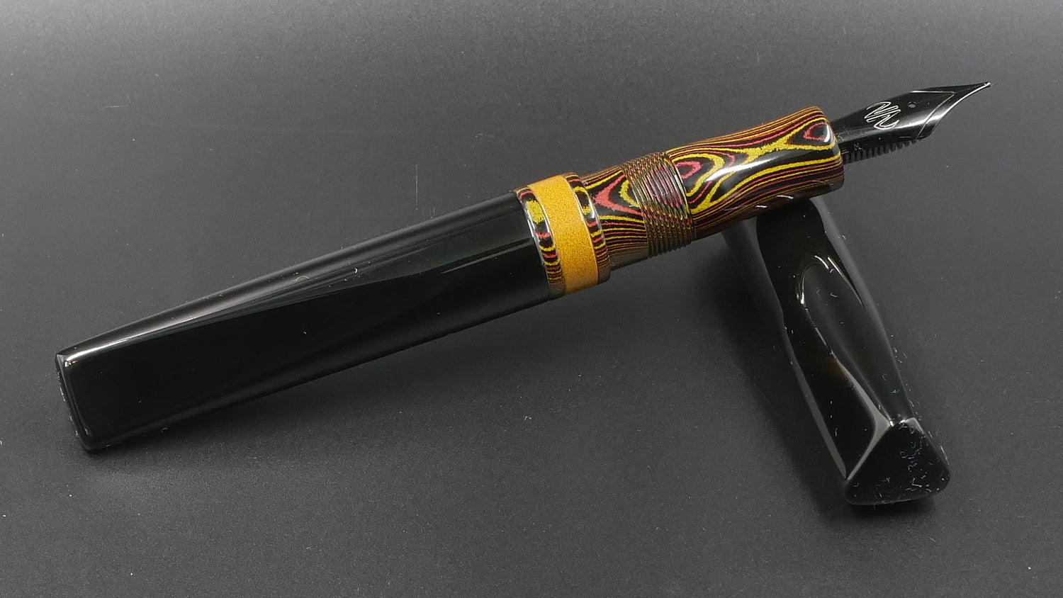 Prospector - Medium - Nikko Autumn lines and Solid black ebonite - Jowo #6 nib
