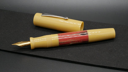 Orville - oversize - Beige and Vesuvius ripple ebonite, doublet - clip - #6 nib