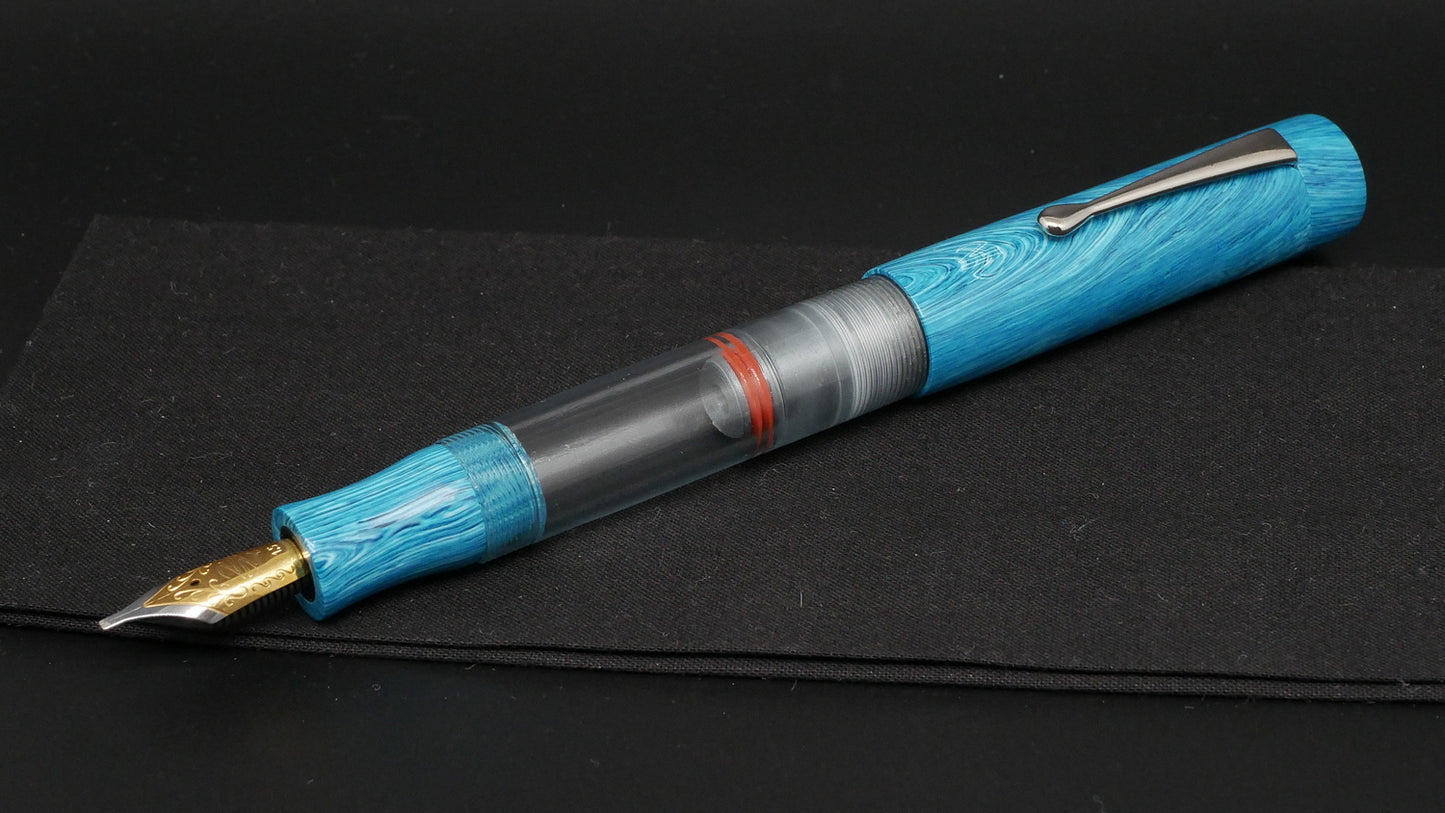 Orville - Large - Blue Juma swirl, clear gray acrylic - clip - piston - #6 nib