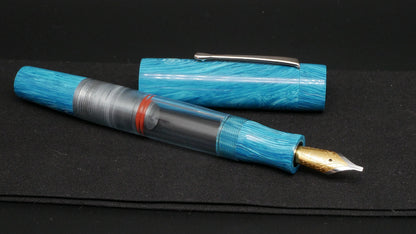 Orville - Large - Blue Juma swirl, clear gray acrylic - clip - piston - #6 nib