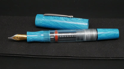 Orville - Large - Blue Juma swirl, clear gray acrylic - clip - piston - #6 nib