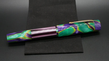 Orville - oversize - Mad Mardi Gras and purple striped acrylic, doublet - clip - #6 nib