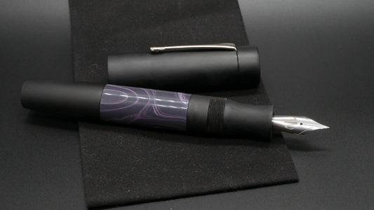 Orville - oversize - Matte Black and Purple Rain swirl ebonites, doublet - clip - #6 nib