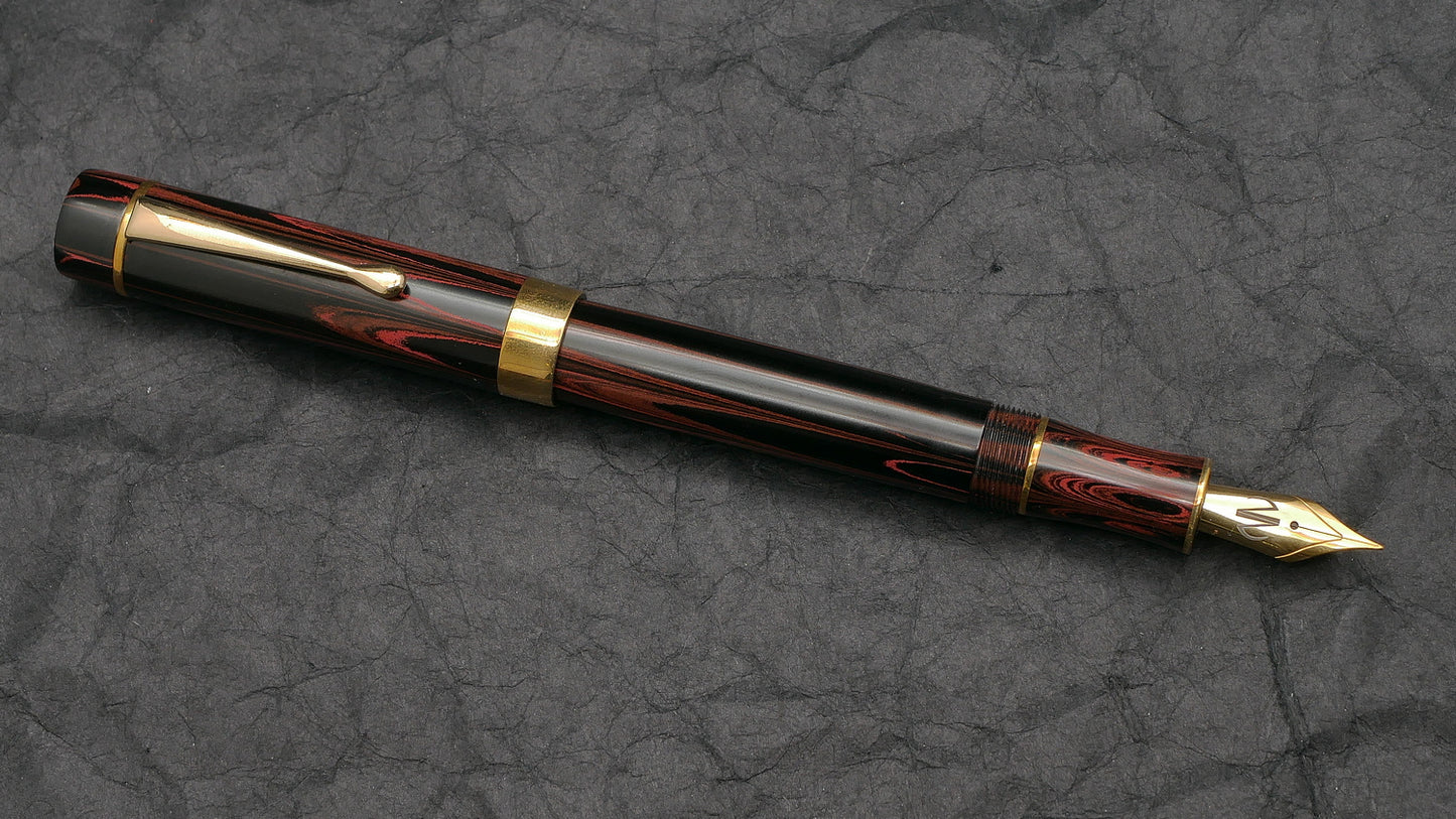 Orville - Medium - SEM Red ripple ebonite - brass trim - clip - #6 nib