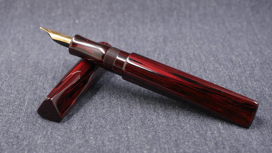 Prospector - Medium - NYH Red woodgrain ebonite - Jowo #6 nib