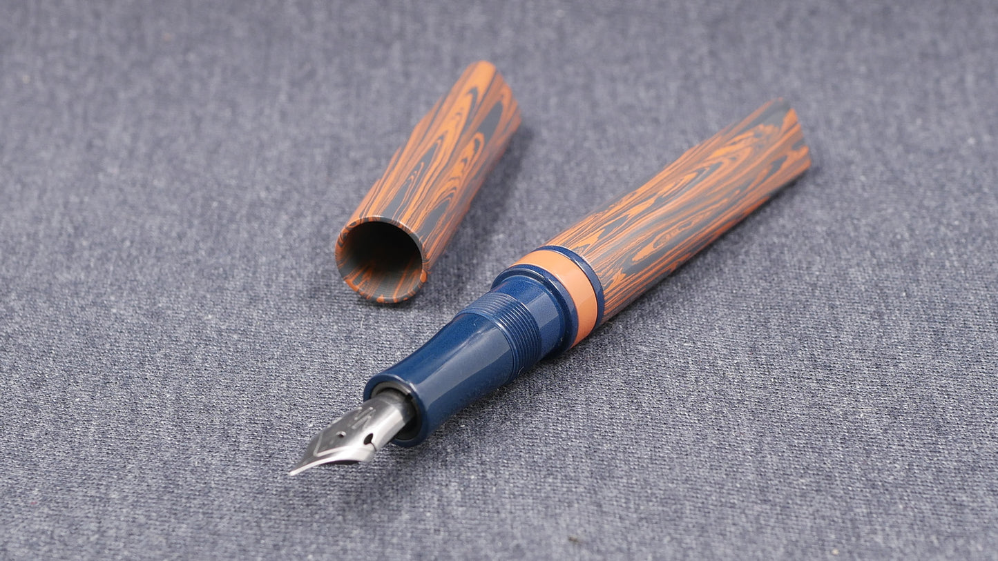 Prospector - Small - NYH Orange/blue gray ripple and blue ebonite - Jowo #6 nib