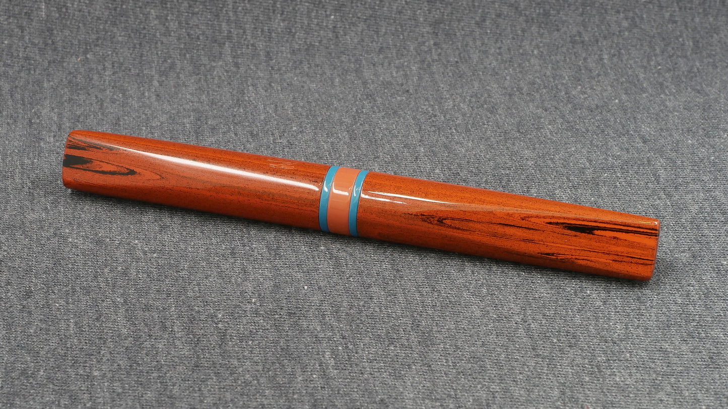 Prospector - Small - NYH orange woodgrain, blue and orange ebonites - Jowo #6 nib