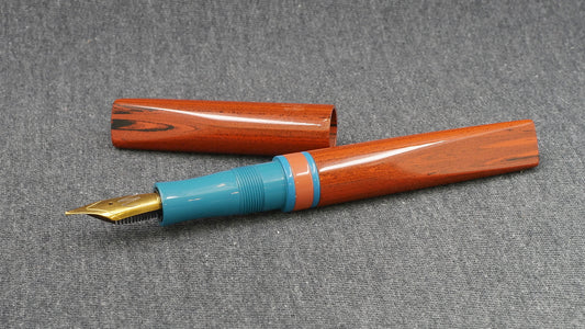Prospector - Small - NYH orange woodgrain, blue and orange ebonites - Jowo #6 nib