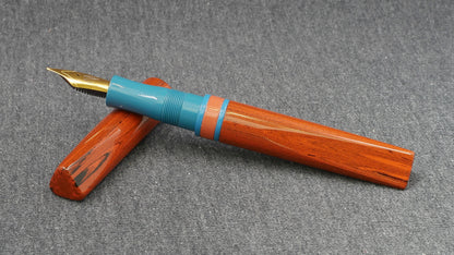 Prospector - Small - NYH orange woodgrain, blue and orange ebonites - Jowo #6 nib
