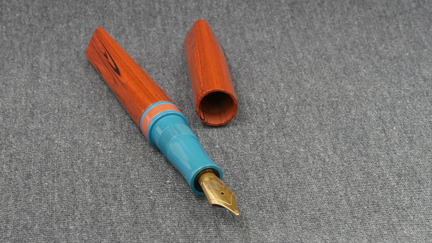 Prospector - Small - NYH orange woodgrain, blue and orange ebonites - Jowo #6 nib