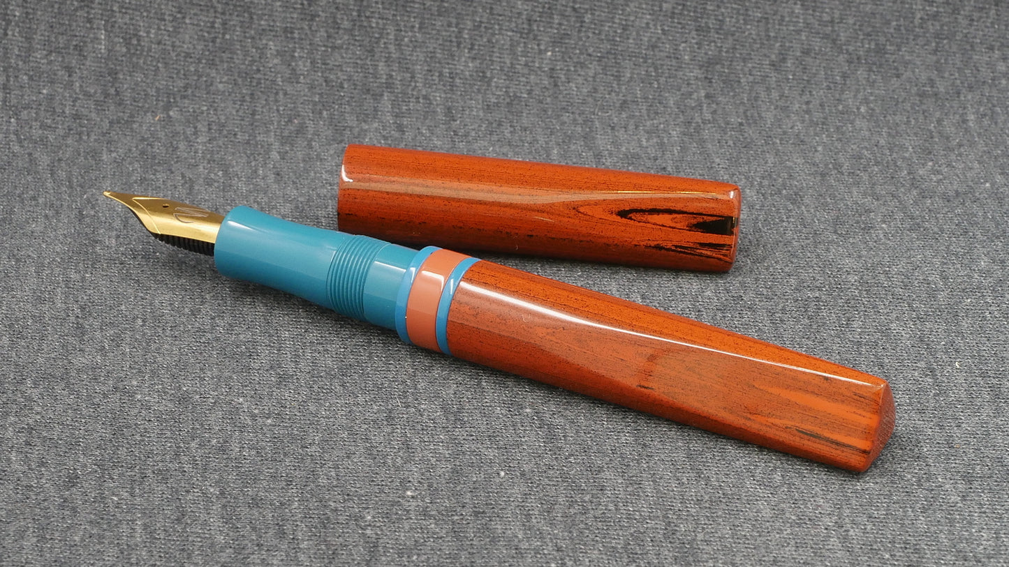 Prospector - Small - NYH orange woodgrain, blue and orange ebonites - Jowo #6 nib