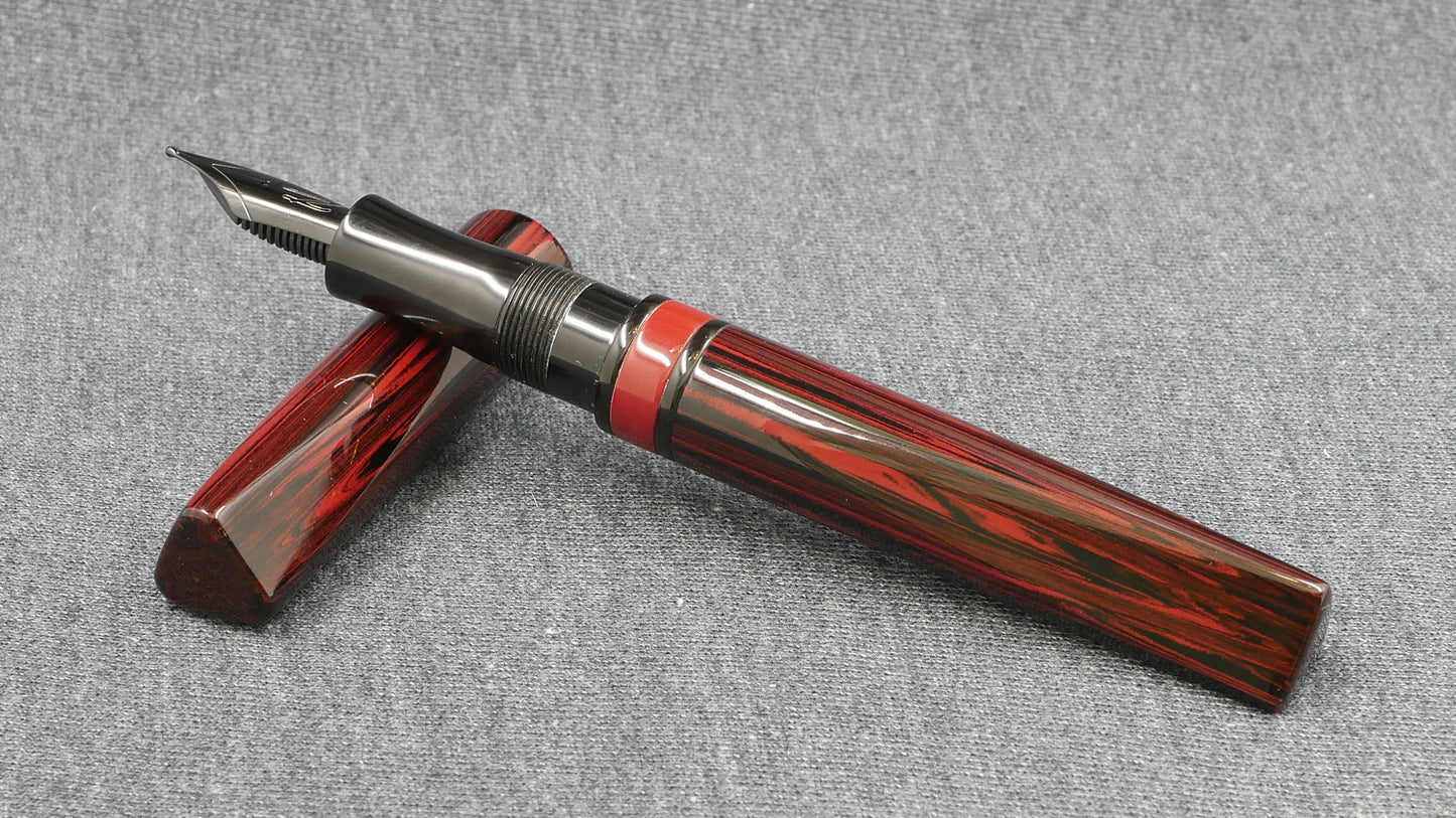 Prospector - Small - NYH red woodgrain, black adn red ebonites - Jowo #6 nib