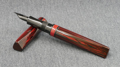 Prospector - Small - NYH red woodgrain, black adn red ebonites - Jowo #6 nib