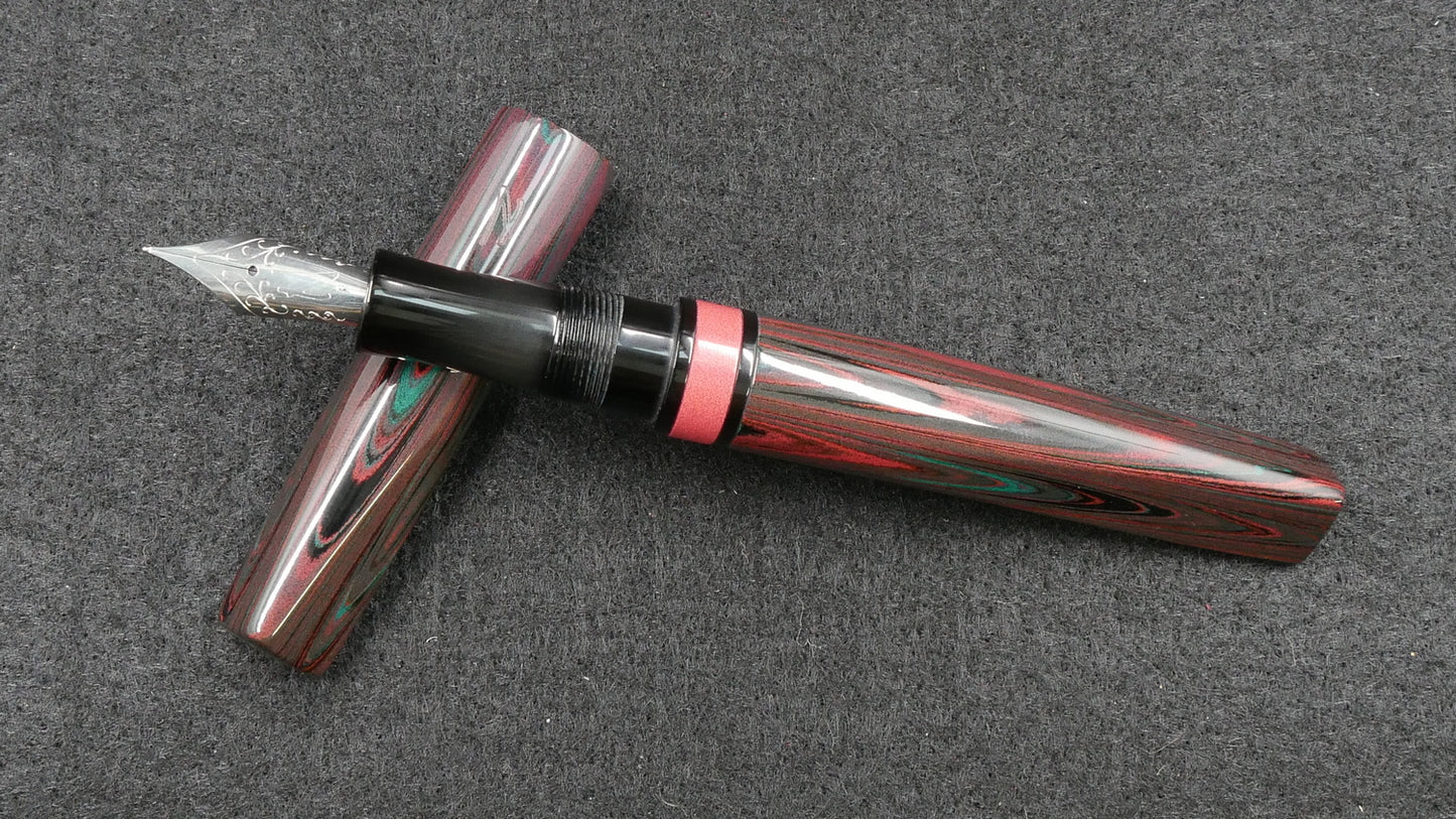 Prospector - Small - Nikko Dark Red-Green ripple and solid black ebonite - Jowo #6 nib