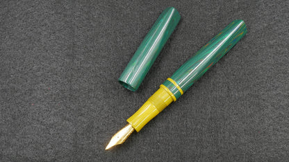 Prospector - Small - Nikko Dark Green ripple and solid yellow ebonite - Jowo #6 nib
