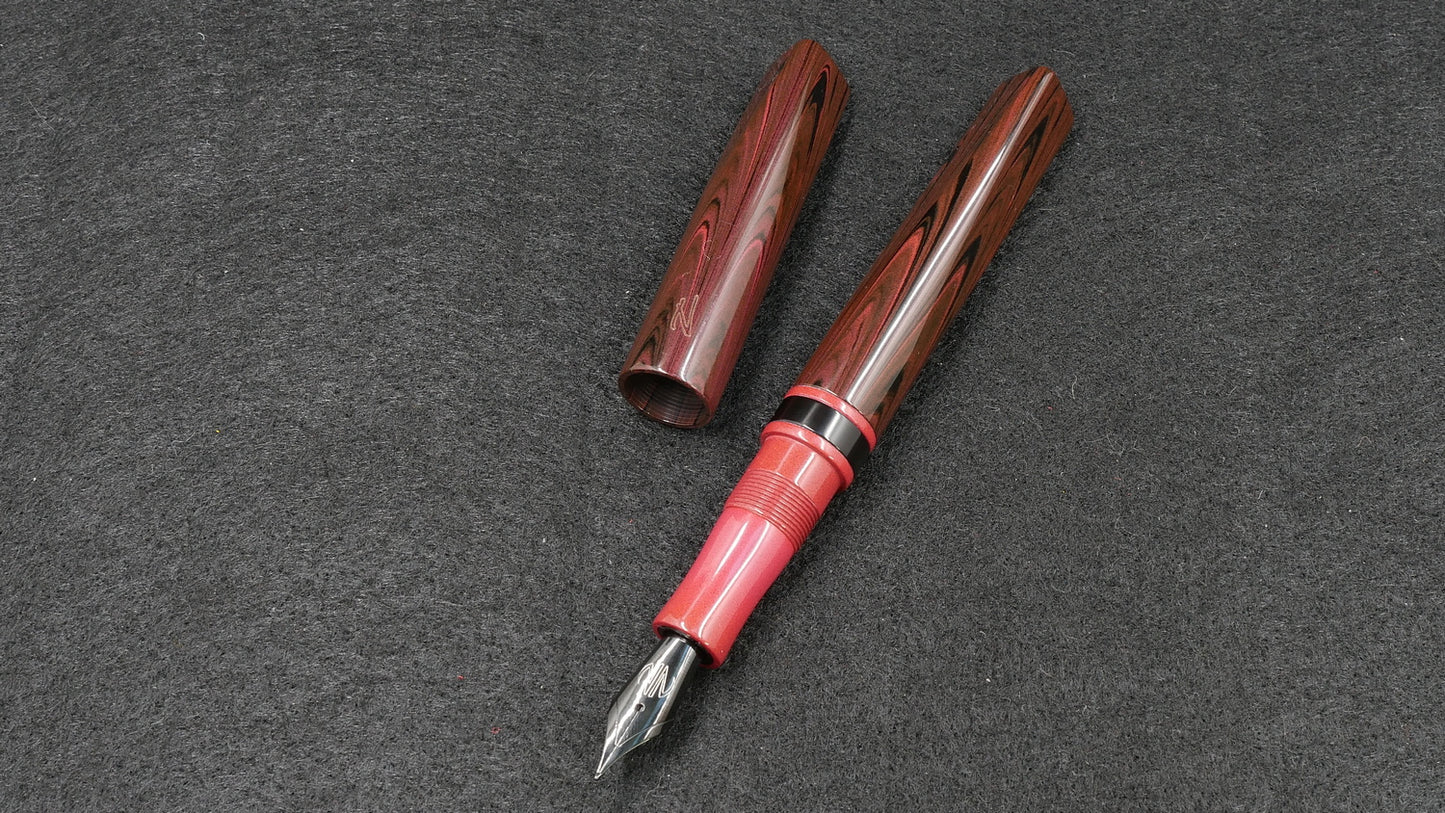 Prospector - Small - Nikko red ripple, solid red and black ebonite - Jowo #6 nib
