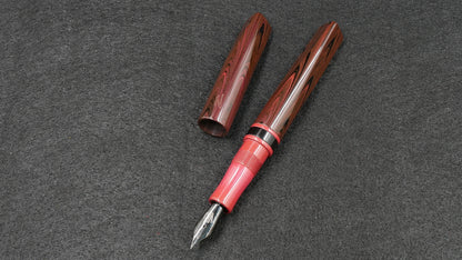 Prospector - Small - Nikko red ripple, solid red and black ebonite - Jowo #6 nib