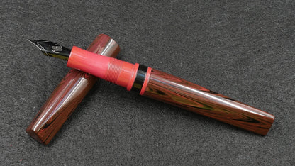 Prospector - Small - Nikko red ripple, solid red and black ebonite - Jowo #6 nib