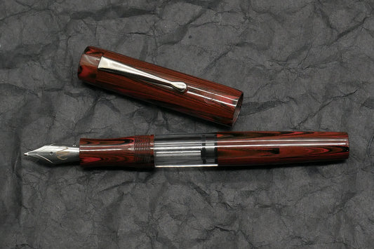 Orville - Medium - Red ripple ebonite, clear acrylic - clip - piston - #6 nib