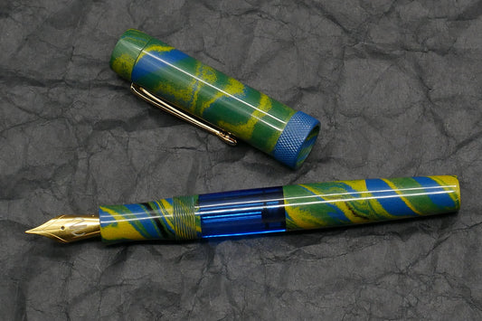 Orville - Medium - Tropical ebonite, blue acrylic, knurled ring - clip - piston - #6 nib