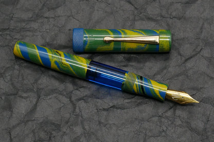 Orville - Medium - Tropical ebonite, blue acrylic, knurled ring - clip - piston - #6 nib