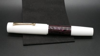 Orville - oversize - White and dark purple ripple ebonite, doublet - clip - #6 nib