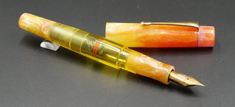 Townsend - Medium – D Squared Arkansas Sunset, clear yellow - clip -  Piston - #6 nib