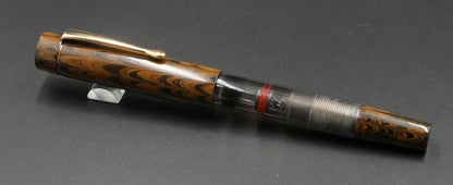 Orville - Small - Brown ebonite, clear gray with a cool smudge acrylic - clip - piston - #6 nib