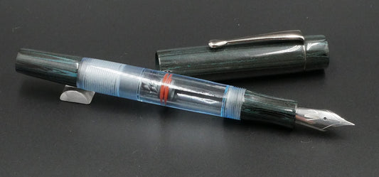 Orville - Small - NYH Teal ebonite, clear blue acrylic - clip - piston - #6 nib