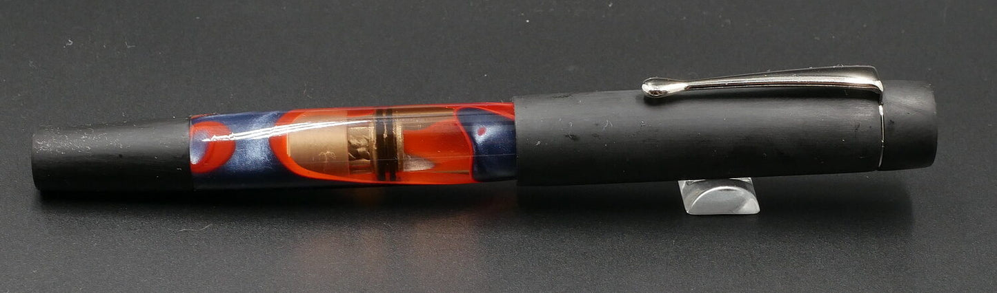 Orville - Small- Black ebonite and blue/red water acrylic - clip - piston - #6 nib