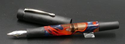 Orville - Small- Black ebonite and blue/red water acrylic - clip - piston - #6 nib