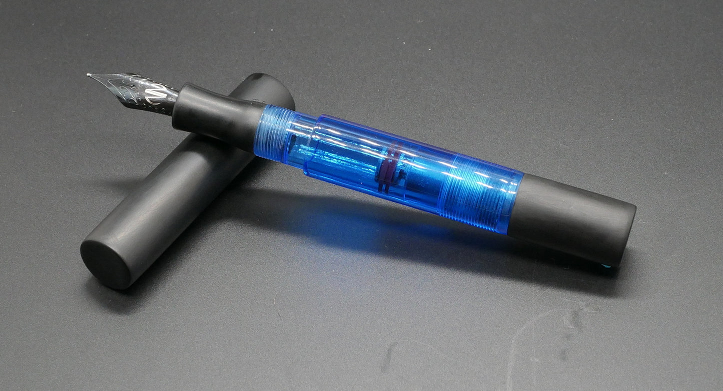 Eastman - Small – Matte black ebonite and clear blue acrylic - piston - #6 nib